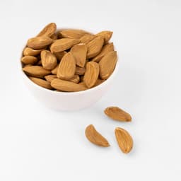 Premium Mamro Badam Small A 1 KG featuring fresh, naturally crunchy almonds in a hygienically sealed pack for healthy everyday nutrition.