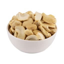 Fresh premium JK grade cashew pieces displayed in a serving bowl, featuring naturally broken kernels with a smooth texture and uniform appearance.