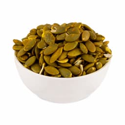 Roasted pumpkin seeds 100 Gms served in a ceramic bowl