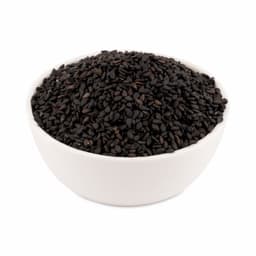 Black sesame seeds 100 Gms displayed in a rustic wooden bowl