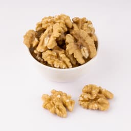 Akhrot (SSP) 250 Gms displayed in a bowl with extra premium walnut kernels and naturally crunchy texture.